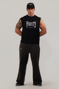 Man wearing a black sleeveless shirt with 'Feroce' branding on a gray background